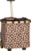 A leopard print shopping trolley with a retractable handle and wheels. Voir les images du produit
