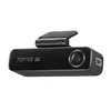 A black dashcam with a carbon fiber texture and a small screen on top, presented against a white background. Produktbild-Vorschau