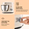 A collage of images showcasing a cream-colored kitchen mixer, its features, and a hand adjusting its speed dial. Produktbild-Vorschau