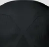 Close-up of the back of a black long-sleeved shirt, showing textured panels. Produktbild-Vorschau