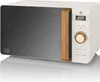 A white and gray microwave with a wood-effect handle and control knob, displayed on a reflective white surface. Anteprima dell’immagine prodotto