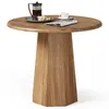 A round wooden table with a French press, a cup of coffee, cookies, and a newspaper on it, set against a white background. Produktbild-Vorschau