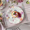 A floral-patterned plate with a tart and berries, set on a wooden table with a fork and knife. Podgląd zdjęcia produktu