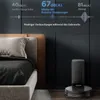 A robot vacuum cleaner and its charging station are shown next to a bed in a bedroom setting. Náhled obrázku produktu