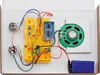 A top-down view of an electronic kit assembled on a white surface. Podgląd zdjęcia produktu