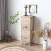 A narrow wooden chest of drawers with decorative drawer fronts and brass handles, placed in a room with a plant, a candle holder, and dried grass. Podgląd zdjęcia produktu