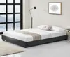 A modern bedroom with a bed, lamp, and artwork. Produktbild-Vorschau
