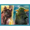 The image is a split illustration showing the Mandalorian and Grogu from Star Wars. The left side depicts the Mandalorian holding Grogu, with a stylized Mandalorian symbol below. The right side shows a close-up of Grogu. Voir les images du produit