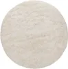 A round, fluffy, cream-colored rug is shown from a top-down perspective on a white background. Produktbild-Vorschau
