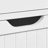 A close-up shot of a white cabinet with a recessed handle. Podgląd zdjęcia produktu