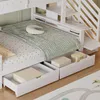 A close-up view of a white bunk bed with storage drawers and a green and white patterned blanket. Produktbild-Vorschau