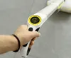 A hand holding the handle of a cleaning device with a digital display. Anteprima dell’immagine prodotto