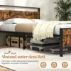 Underneath a bed frame, showing storage space and a measurement. Produktbild-Vorschau