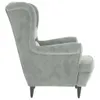 A side view of a grey wingback chair. Anteprima dell’immagine prodotto