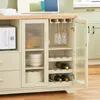 A kitchen cabinet with a microwave, wine rack, and storage shelves. Voir les images du produit