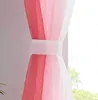 A close-up of a sheer curtain with a vertical color gradient from pink to white, held together by a white fabric band. Produktbild-Vorschau