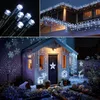Collage of Christmas lights on a house and garden. Produktbild-Vorschau