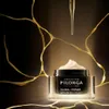 A jar of Filorga Global-Repair Advanced Cream is shown with a dropper dispensing product above it, against a dark background with gold accents. Voir les images du produit