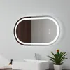 A modern bathroom vanity with a rectangular sink, a faucet, and a decorative plant next to a large oval mirror with integrated LED lighting. Produktbild-Vorschau