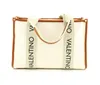 A white tote bag with brown trim and straps with the brand name printed on them, isolated on a white background. Anteprima dell’immagine prodotto
