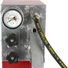 Close-up of a pressure testing pump with a gauge and hose. Náhľad obrázku produktu