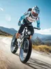 A person riding an electric mountain bike on a dirt road with a scenic mountain landscape in the background. Produktbild-Vorschau
