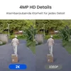 A split image showing a comparison of camera quality, with a person walking with boxes in both halves. Produktbild-Vorschau