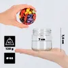 A hand is holding a lid with a fruit pattern above a glass jar, with dimensions indicated. Produktbild-Vorschau