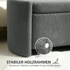 Close-up shot of a grey upholstered storage ottoman, highlighting its textured fabric and protective foot pads. Anteprima dell’immagine prodotto