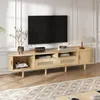A modern TV stand with a television on top, placed in a living room setting. Anteprima dell’immagine prodotto