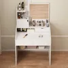 A white vanity table with a mirror, drawers, and shelves, organized with various makeup and beauty products. Produktbild-Vorschau