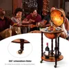 A group of friends are enjoying pizza and drinks around a globe bar. Náhled obrázku produktu