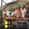 People enjoying a meal outdoors under a large umbrella. Anteprima dell’immagine prodotto