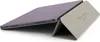 A tablet case is shown in a studio setting. Voir les images du produit