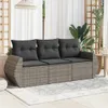 A three-seater outdoor sofa with dark gray cushions placed on a patio with a light gray rug. Náhled obrázku produktu