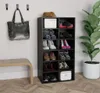 A black shoe rack filled with various shoes and a handbag hanging on the wall next to it. Produktbild-Vorschau
