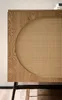 A close-up view of a wooden sideboard with a rattan woven panel. Produktbild-Vorschau
