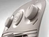 Close-up shot of the control panel of a white appliance, likely a heater or fan, showing two knobs and a timer dial. Voir les images du produit
