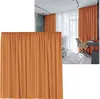 A collage showing a close-up of an orange curtain and a room with orange curtains and a desk. Produktbild-Vorschau