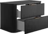 A black bathroom vanity cabinet with two drawers, one partially open. The cabinet has a ribbed texture on the front and sides, and gold-colored handles on the drawers. Anteprima dell’immagine prodotto