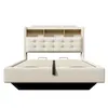 A beige upholstered bed frame with a headboard featuring shelves and tufted detailing, shown from the front with the mattress support visible. Anteprima dell’immagine prodotto