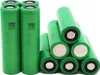 A pile of green cylindrical batteries. Produktbild-Vorschau