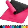 A pink yoga mat is partially unrolled, revealing its black underside. A row of smaller, rolled mats in various colors is displayed at the bottom. Náhled obrázku produktu