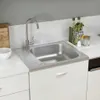A stainless steel kitchen sink with a faucet and drainboard is shown on a white countertop. Voir les images du produit