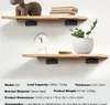Two wooden shelves mounted on a white wall, decorated with a sculpture, books, a clock, and a potted plant. Podgląd zdjęcia produktu