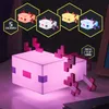 A pixelated axolotl lamp is shown in the foreground, with smaller pixelated axolotls in different colors displayed in hexagonal frames in the background. Anteprima dell’immagine prodotto