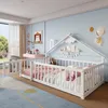 A child's bedroom with a white house-shaped bed, pink bedding, and a desk. Podgląd zdjęcia produktu