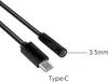 A black USB-C to 3.5mm audio adapter cable is shown against a white background. The cable has a Type-C connector on one end and a small cylindrical component with a lens on the other, labeled '3.5mm'. Anteprima dell’immagine prodotto