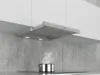 A modern kitchen scene with a stainless steel range hood installed above a stovetop with a pot emitting steam. Náhled obrázku produktu