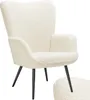 A fluffy cream armchair with black legs. Produktbild-Vorschau